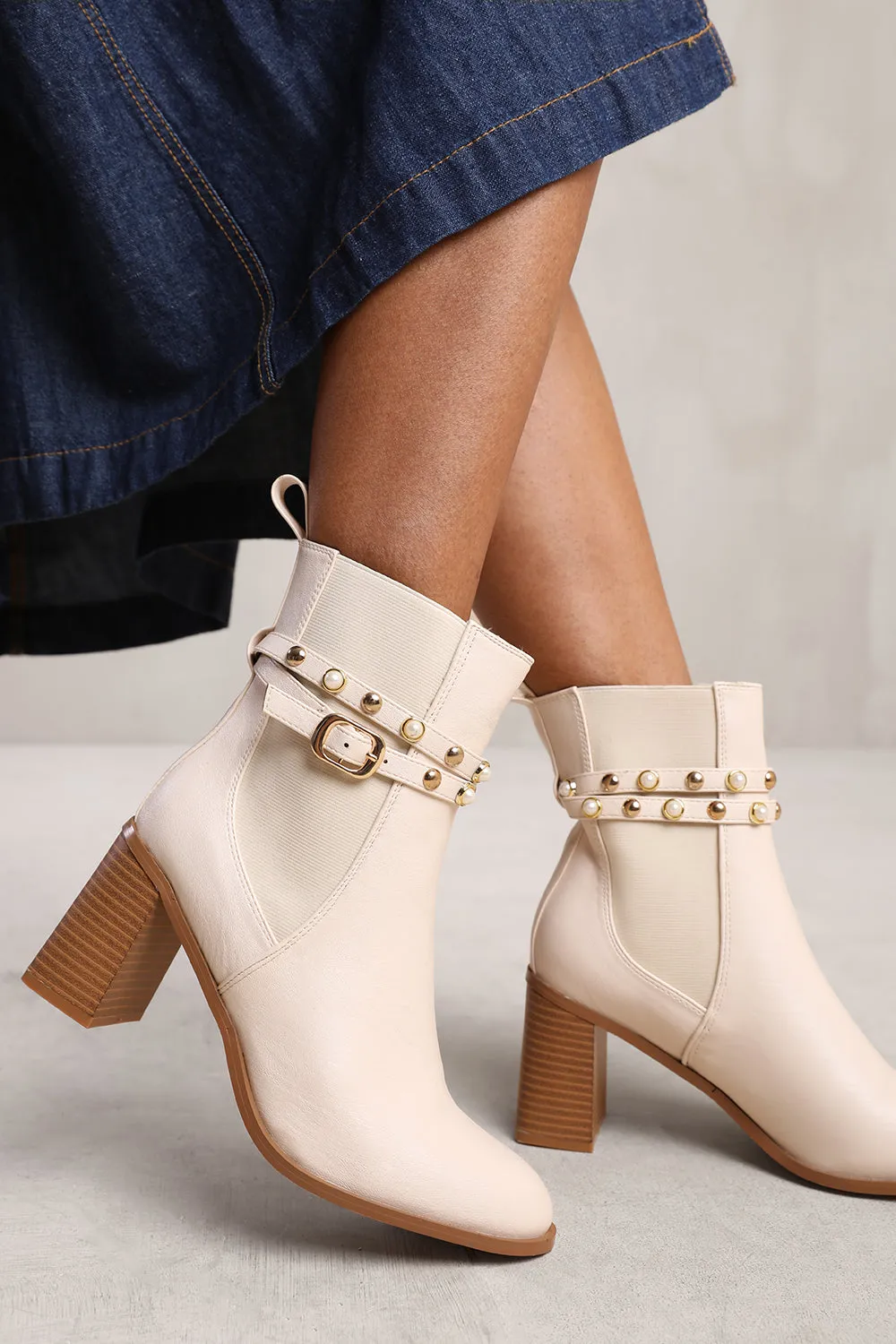 JAYLA ANKLE BOOT WITH PEARL AND STUD DETAILING IN CREAM